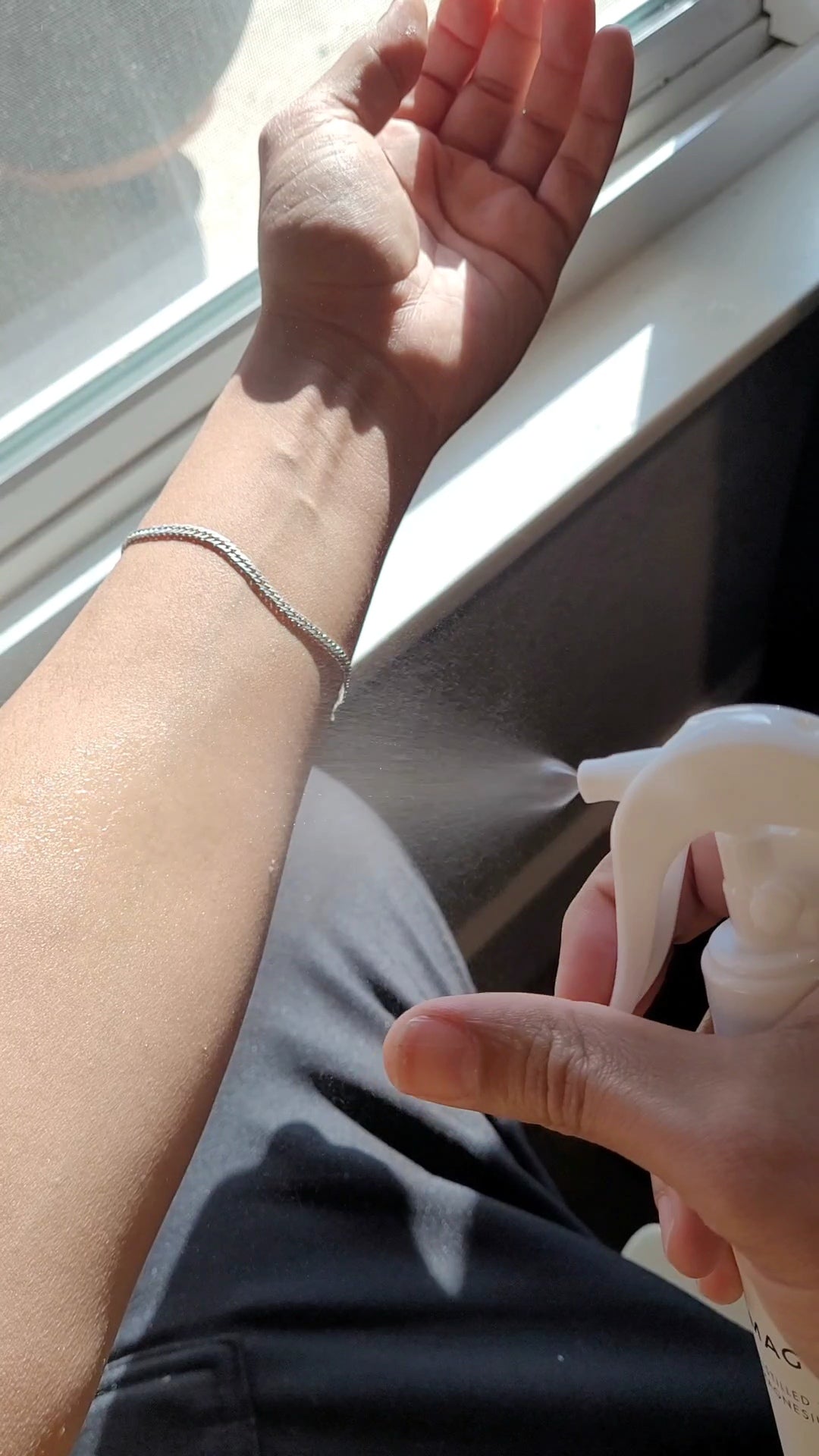 100 mL spray bottle labeled "SOL SALT". Short video clip of spraying magnesium oil onto the forearm and massaging until dry.