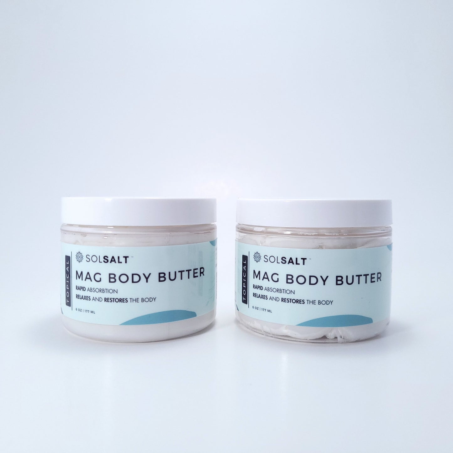 Two 6 oz jars labeled 'SOL SALT' on a light gray background. Nourishing magnesium body butter for soft skin & muscle relief. Creamy, non-greasy. 
