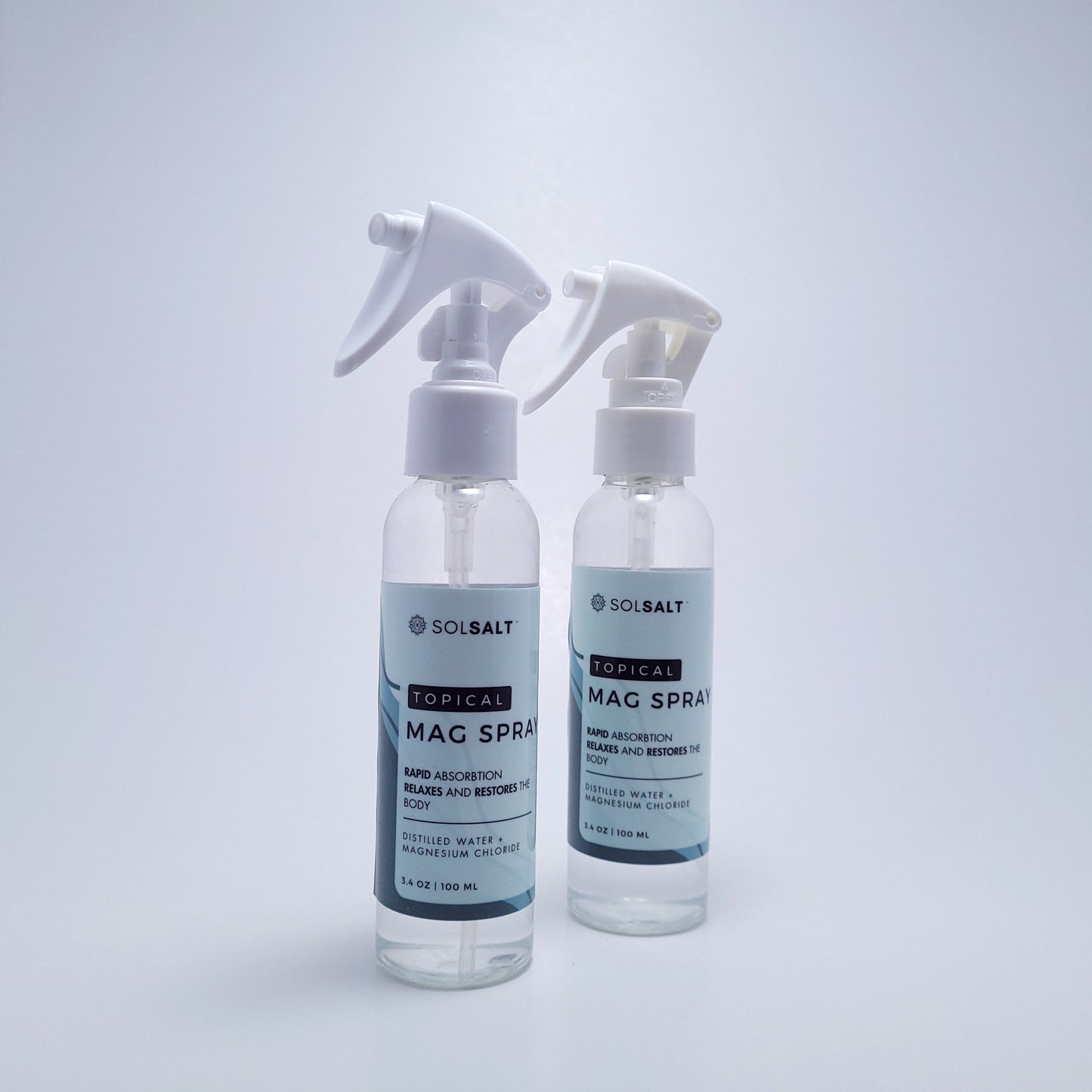 Two 100mL Spray bottles labeled 'SOL SALT' on a light gray background. Rapid Absorption. Relaxes and Restores the body.